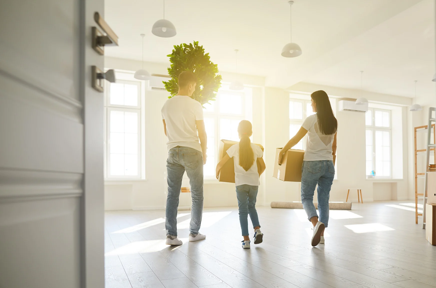 family moving boxes into a clean home